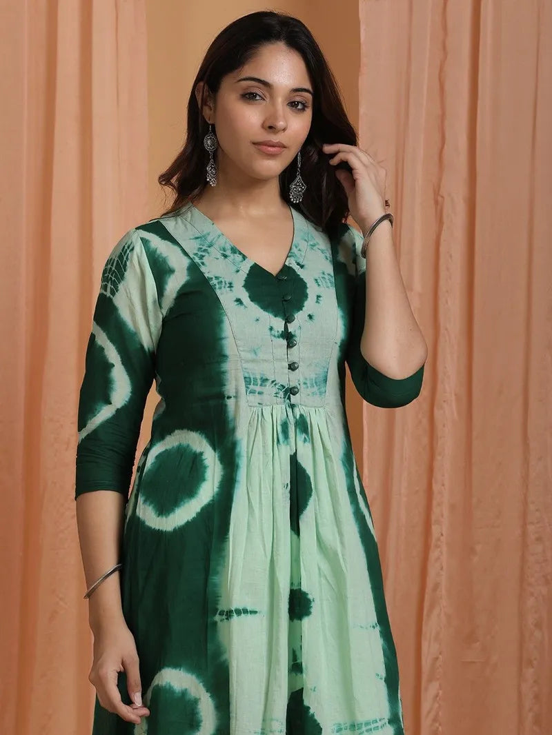 close‑up of soft green tie‑and‑dye pattern on cotton fabric