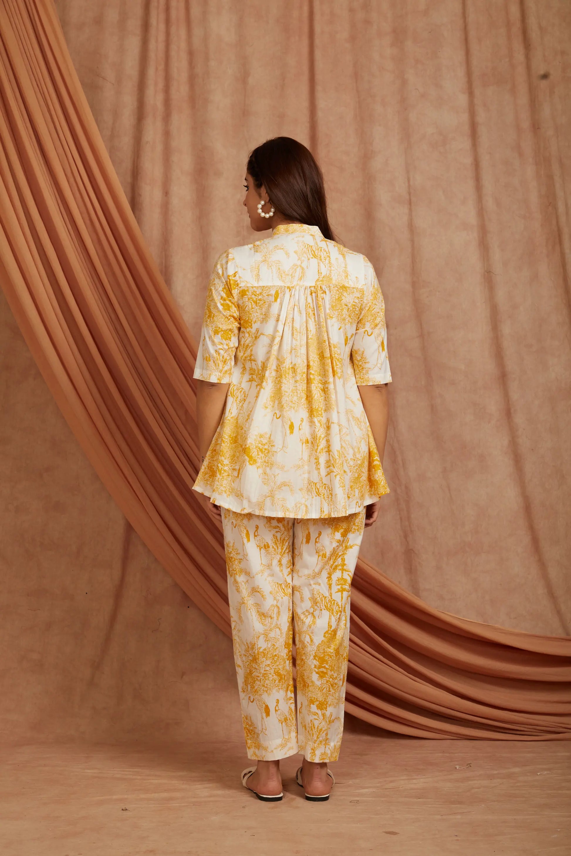 model wearing white yellow cotton co‑ord set by SIVI Collection