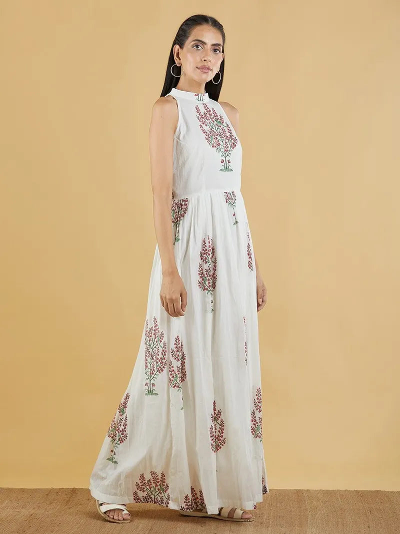 model wearing flowy off‑white and brown block print dress