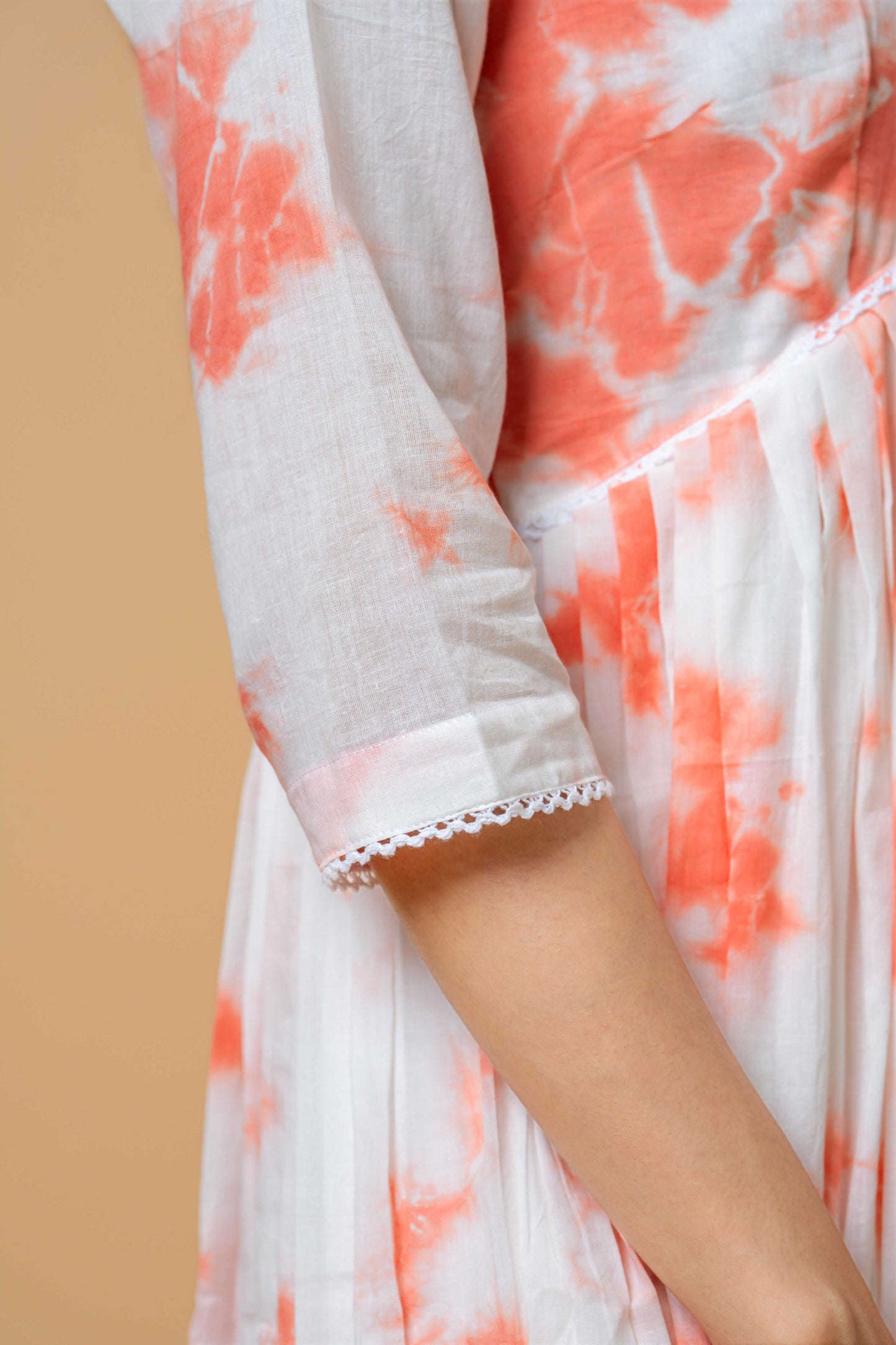 close-up of hand tie-dye texture in peach