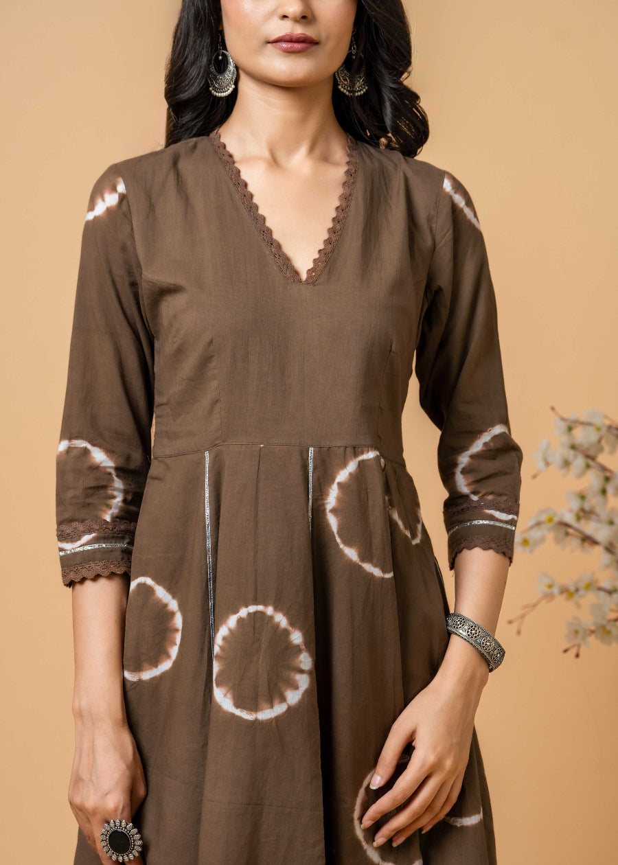 model in brown tie-dye suit set by SIVI Collection