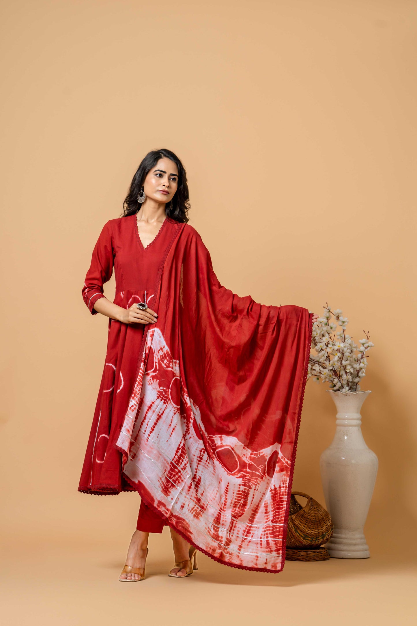 model wearing red tie-dye suit by SIVI Collection