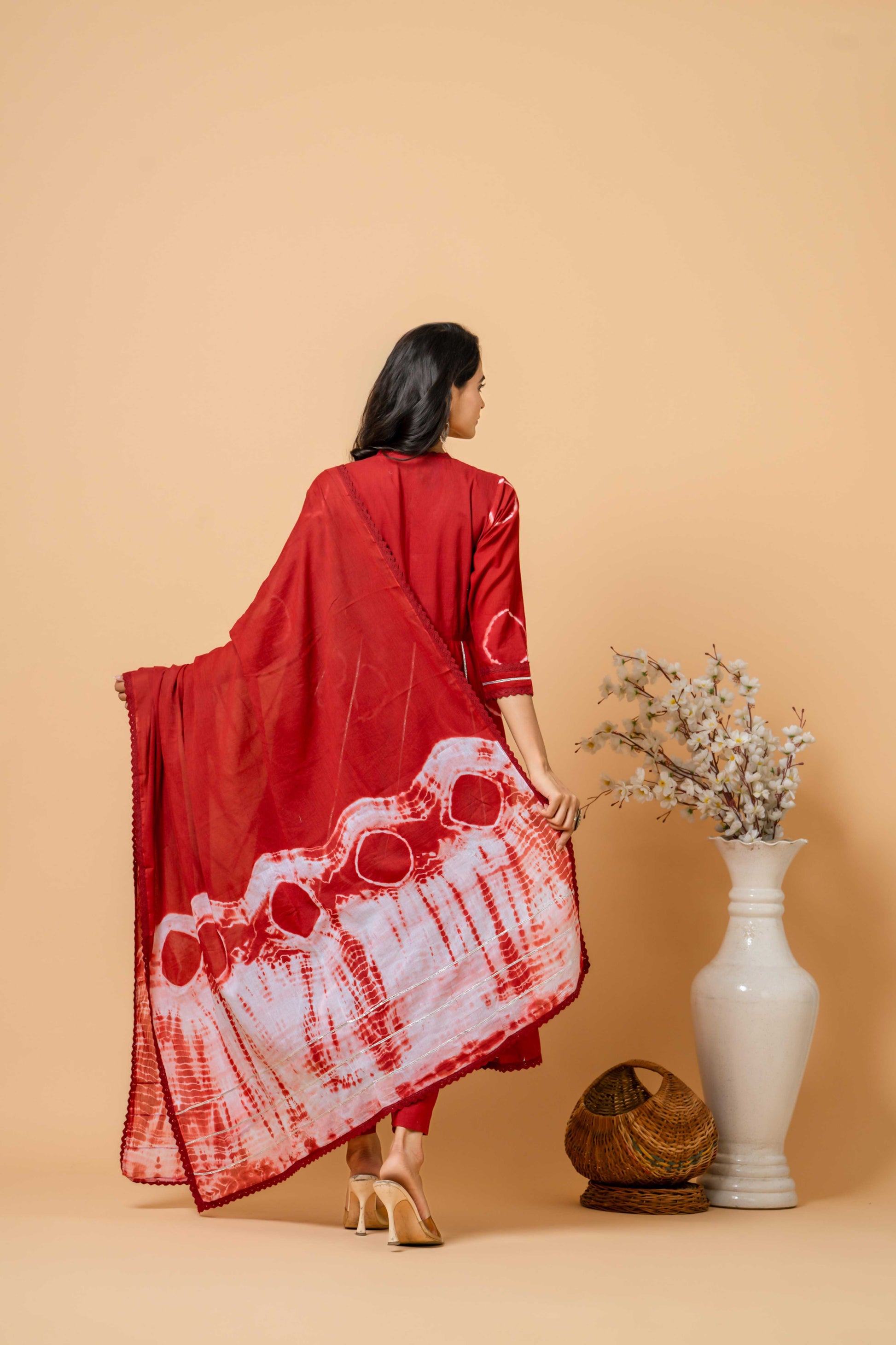 model wearing red tie-dye suit by SIVI Collection