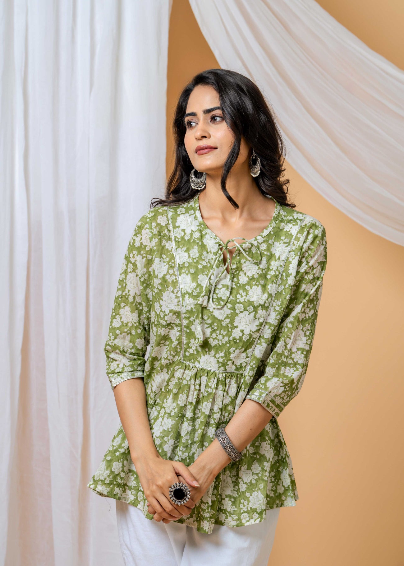 model wearing green floral co-ord set by SIVI Collection