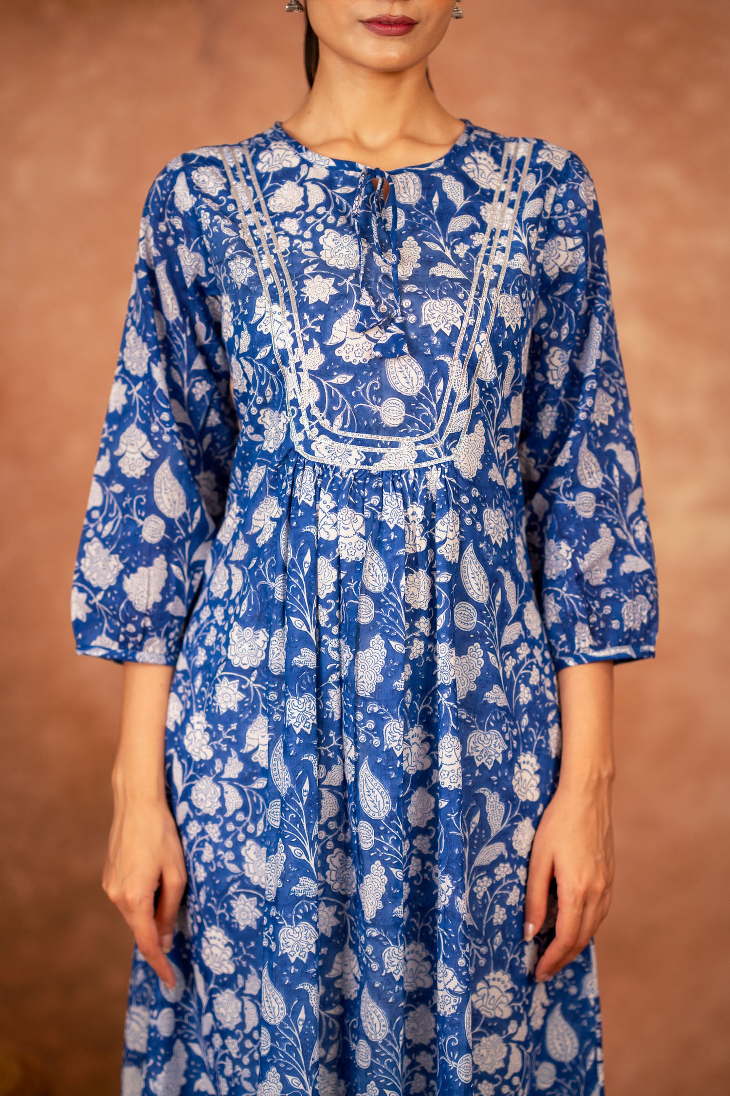 close up of blue floral hand-block print on cotton fabric