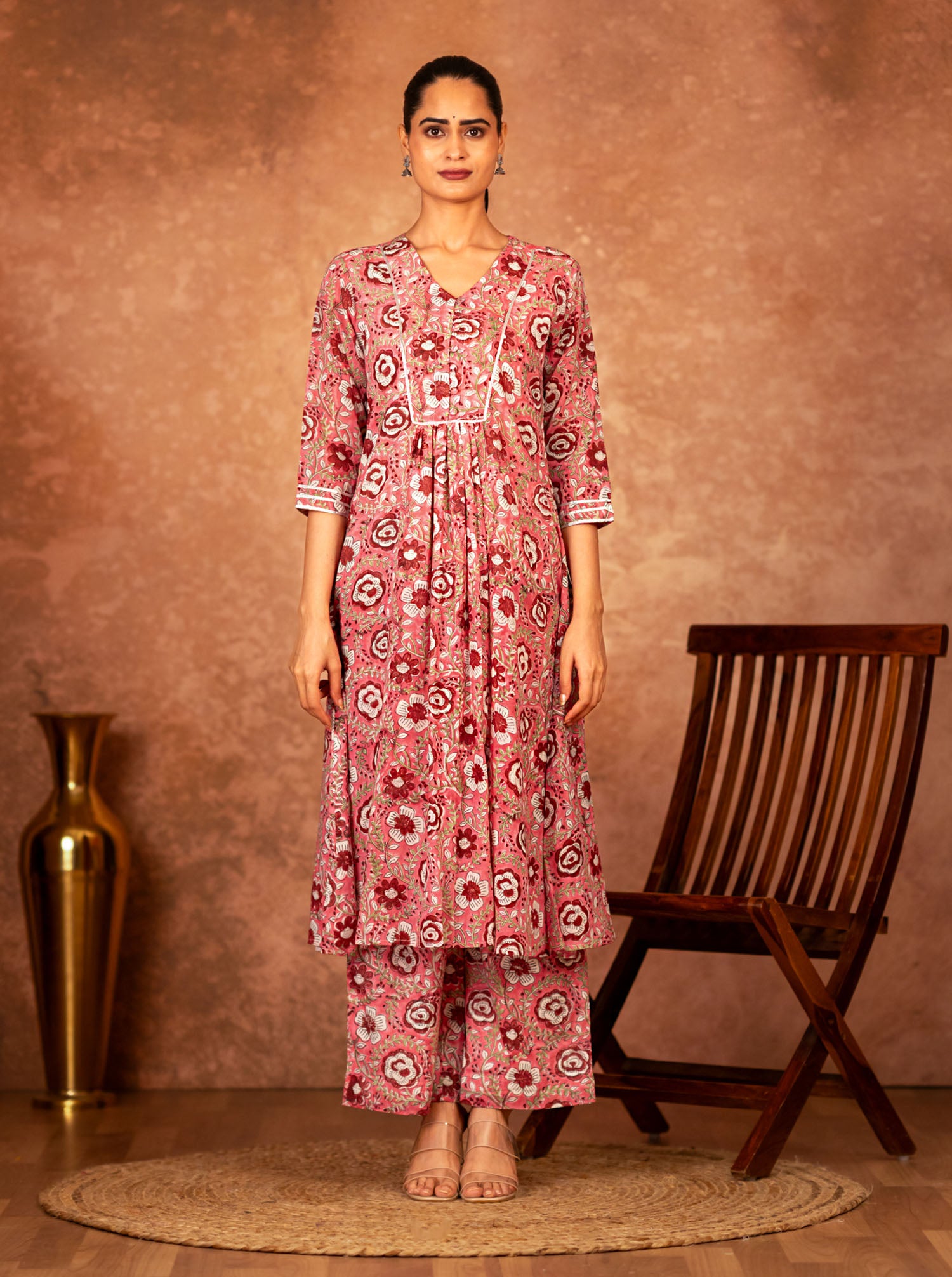 Woman wearing Sivi pink floral kurta with pants 